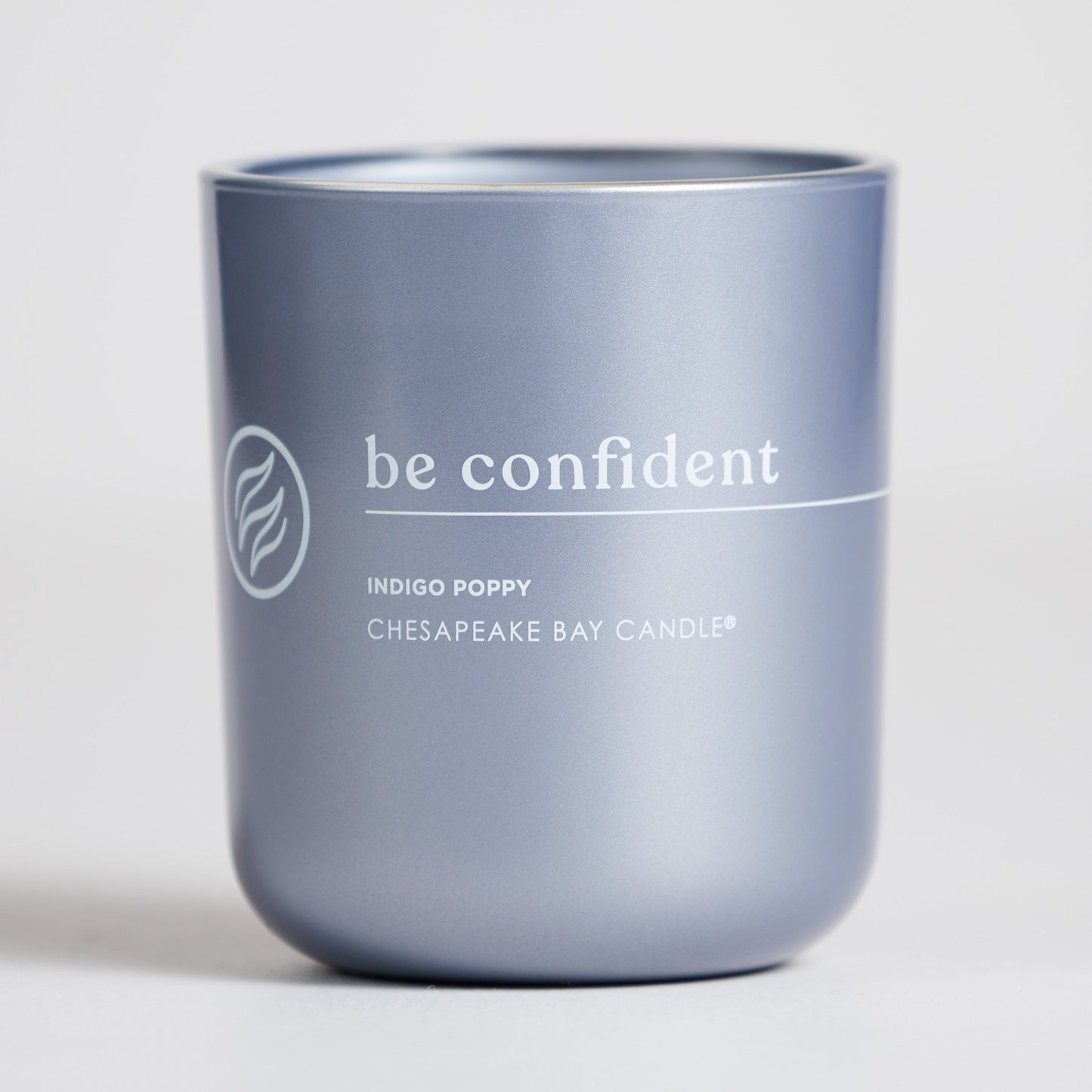 chesapeake bay candle intentions collection be confident indigo poppy medium two wick candle in a white backdrop
